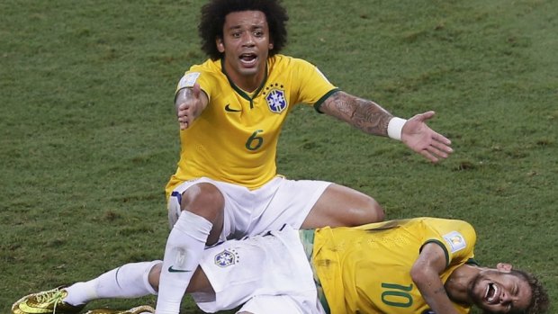Ruled out: Marcelo gestures over his injured teammate Neymar.