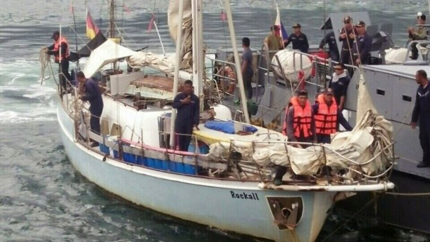 Philippine Navy personnel board the yacht "Rockall" after it was found abandoned in the Sulu Sea in southern Philippines over the weekend. 