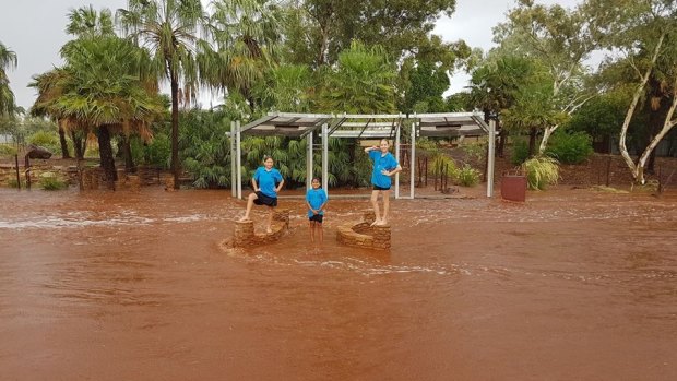 Students making the most of the flood waters. 