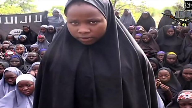 A screengrab from a video of  Boko Haram shows an abducted girl talking to the camera at an undisclosed rural location. 