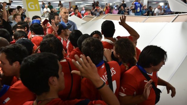 Chile's fans storm the media centre at the Maracana Stadium in Rio.