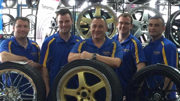 Slain criminal Hamad Assaad (far right) with the Tyres for Less team in a photograph from 2015.