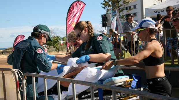 Raija Ogden is taken away on a stretcher.