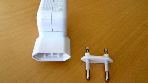 A Reddit user said 'bad glue' caused this Apple adapter to break when it was removed from the wall socket, exposing live prongs.