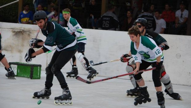 Two of the now 115 teams take to the rink to battle it out  in the Street Roller Hockey League. 