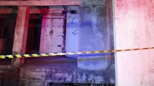 Police tape cordons off the abandoned building where the girl was killed.