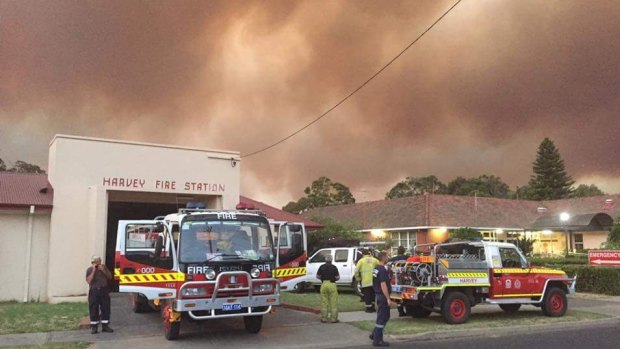 Weary firefighters at Harvey Fire Station on Monday. 