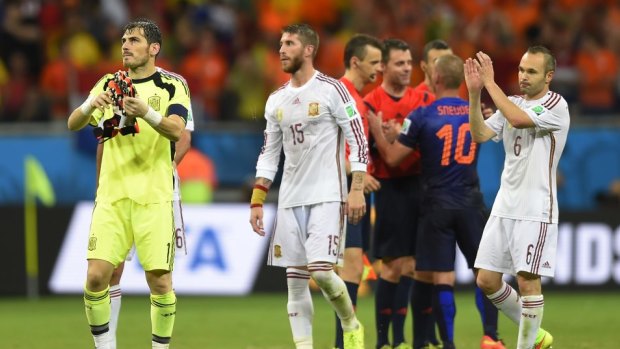 Spanish players react after the heavy defeat to the Dutch.