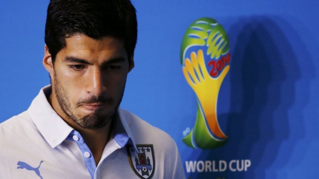 Out of the World Cup: Uruguay's Luis Suarez has been banned by FIFA for nine international matches for biting Italian defender Giorgio Chiellini.