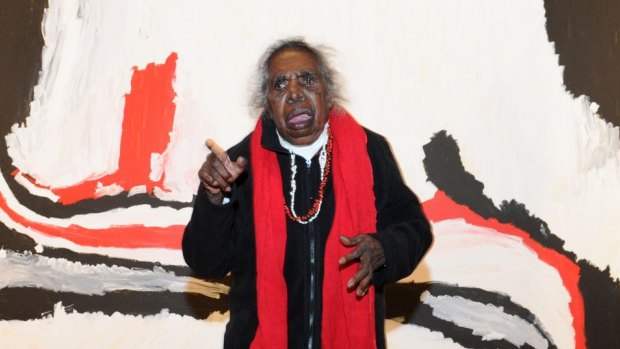 Sally Gabori dances in front of her work, Nyinyilki, painted on Mornington Island, in May 2012.