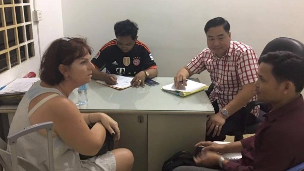 Australian nurse Tammy Davis-Charles is questioned by Cambodian police in November of last year.