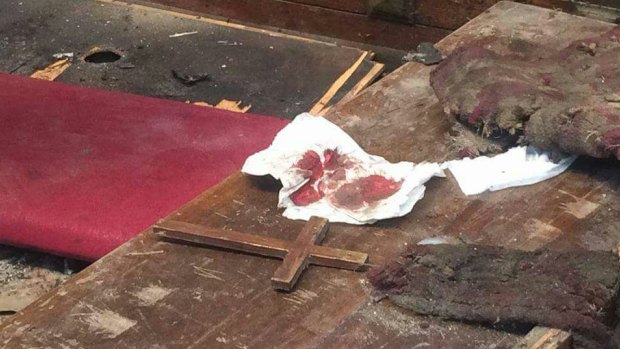 Blood and debris in the aftermath of the blast at the church of St Peter and St Paul in Cairo. 
