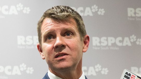 NSW Premier Mike Baird, right, joined by Deputy Premier Troy Grant, left, and RSPCA chief executive Steven Coleman, announces the details for the greyhound racing transition plan at the RSPCA Centre at Yagoona in Sydney, in July. 