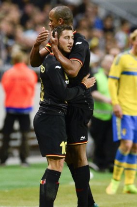Eden Hazard and Vincent Kompany celebrate a goal.
