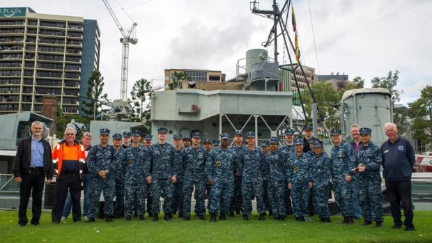 Sailors from theUSS George Washington  pose with staff members of the Queensland Maritime Museum after doing a restore and clean-up on the Diamantina.