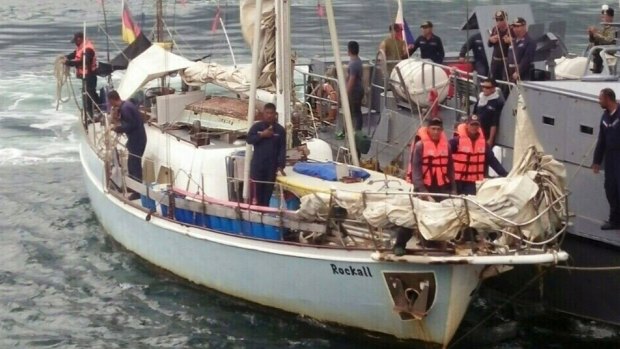 Philippine Navy crew board a yacht named "Rockall" after it was found abandoned off the Sulu Sea in southern Philippines.