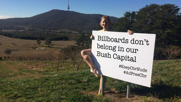 Deb Cleland poses in a cheeky social media campaign hoping to keep Canberra 'nude' - billboard-free. 