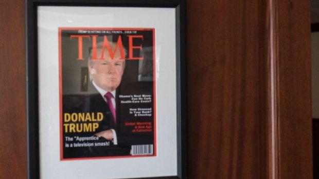 A fake edition of Time Magazine with Donald Trump on the cover hangs in a number of Trump properties.