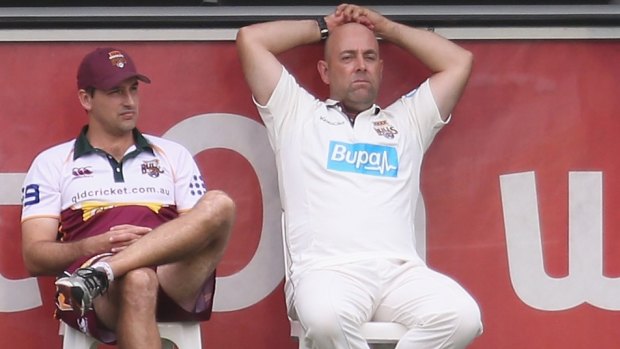 Queensland Bulls interim coach Justin Sternes, on the sidelines with current national coach Darren Lehmann.