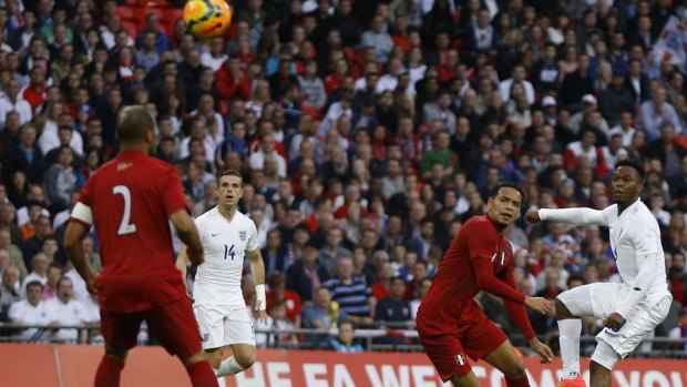 Opening goal: Daniel Sturridge curls home to put England in front.
