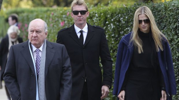 Alan Jones, Brett Lee and Lana Anderson arrive at Paul Ramsay's funeral.