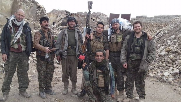 Ashley Johnston, far right, who was killed fighting Islamic State militants.