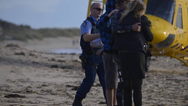 Distraught witnesses at the scene of the attack near Mandurah.