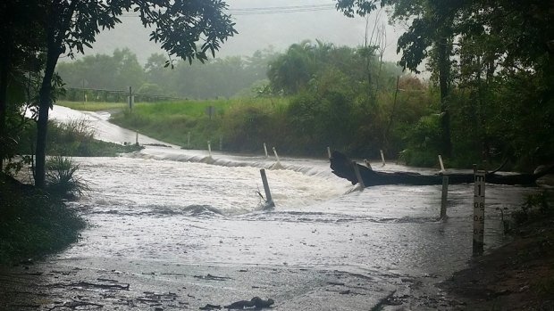 Flooding is cutting roads across north Queensland. Here, Shannonvale Road at Shannonvale is cut west of Port Douglas.