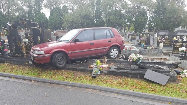 A car has crashed into a number of headstones at a Melbourne cemetery.