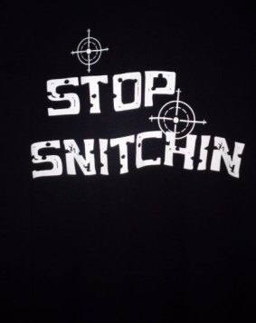 Stop snitching T-shirt logo with crosshairs and bullet holes.