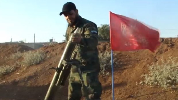 A Turkmen rebel manning a mortar in the fight against Bashar al-Assad's forces.