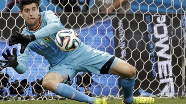 Thibaut Courtois blocks a shot during the World Cup round of 16 match between Belgium and the USA.