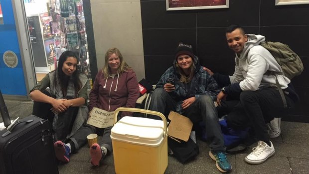 Siham and Mirwan Carollisen (far right and far left) helping the homeless in Northbridge earlier this year. 