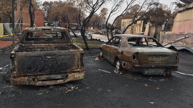 Burnt out cars belonging to volunteer firefighters in Yarloop.