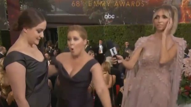 Giuliana Rancic could not hide her shock at Amy Schumer's menstrual humour, while Schumer danced in delight with sister Kim Caramele.
