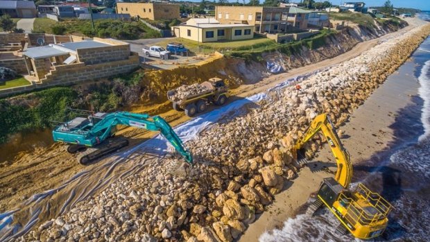 The seawall of nearly 600 metres is to protect 15 homes and now a public reserve with a car park, boat ramp, access road and boardwalk. 