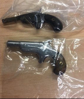 The two weapons allegedly found by police on the man and in his vehicle.