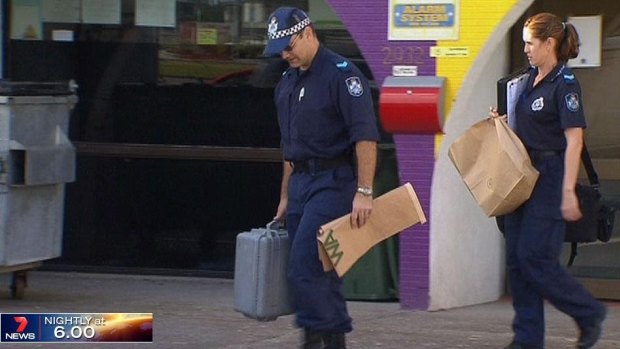 Police seize items during a raid on an Islamic store in Logan, south of Brisbane. 