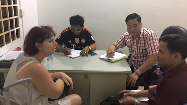 Australian nurse Tammy Davis-Charles is questioned by Cambodian police in November of last year.