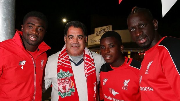 Queensland Rugby League legend and Liverpool FC fan Mal Meninga with Liverpool FC players, from left, Kolo Toure, Sheyi Ojo and Mamadou Sakho at the renaming of Caxton st as Anfield Road to celebrate the arrival of Liverpool FC in Brisbane.