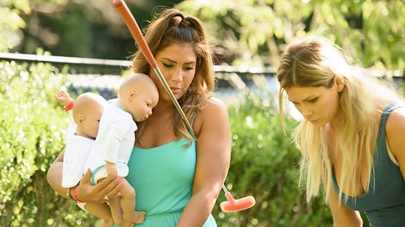 The Bachelor Australia contestants with their baby simulators. 