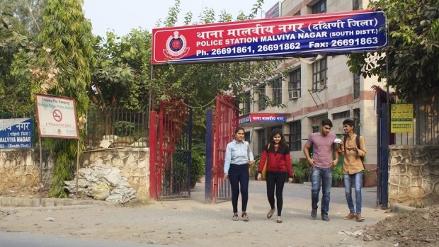 A group of young men and women leave a police station in South Delhi.