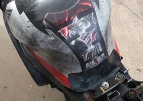 The image of a face on the motorbike.