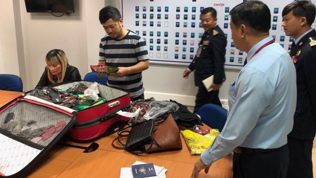 Australian Federal Police played a key role in the arrest of 39-year-old Ve Thi Tran, far left, on Saturday morning as she was about to fly to Australia via Hong Kong. 