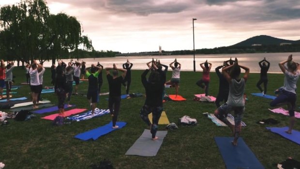 Join in yoga by the lake at Bowen Park.