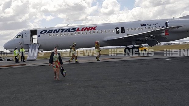 The Qantas link plane evacuated on the runway. 