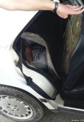 A second migrant was found hiding under a car seat. 