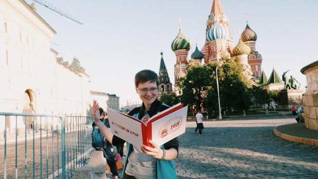 A russian LGBT activist reads <i>I Think I'm a Poof</i> in Moscow.