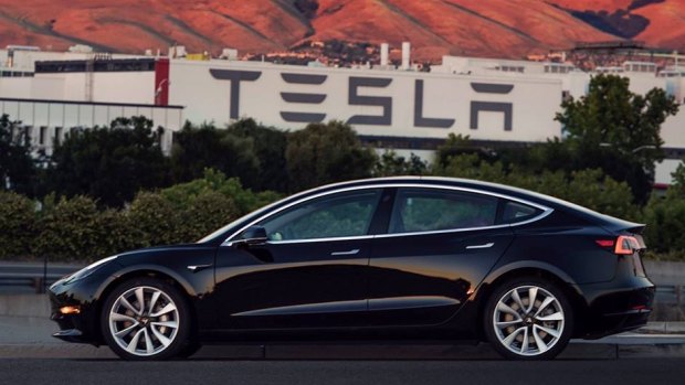 The first 30 customers -- company employees -- took delivery of the new Model 3 on Friday at Tesla's single factory.