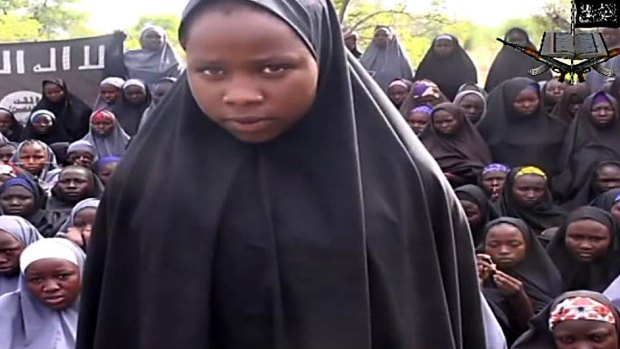 An image from a Boko Haram video shows a girl talking in an undisclosed location. 
